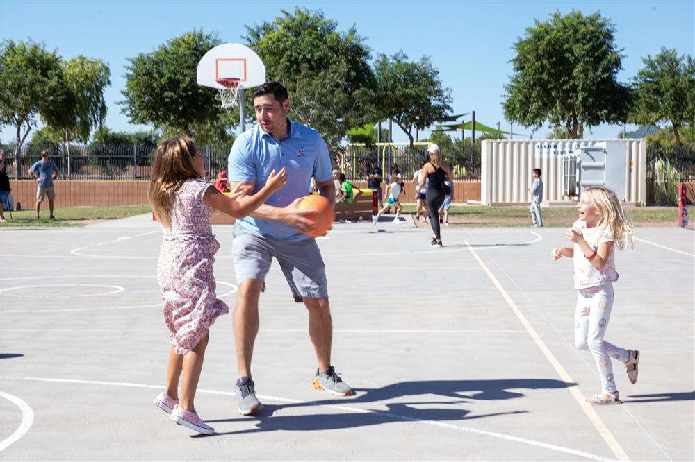 Families visit students during lunch and play games.